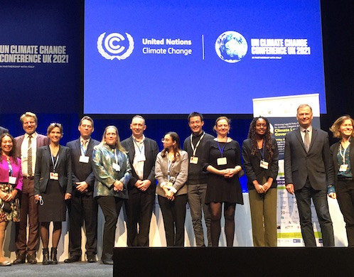 Foto der Teilnehmer des COP26-Panels. Quelle: IKEM